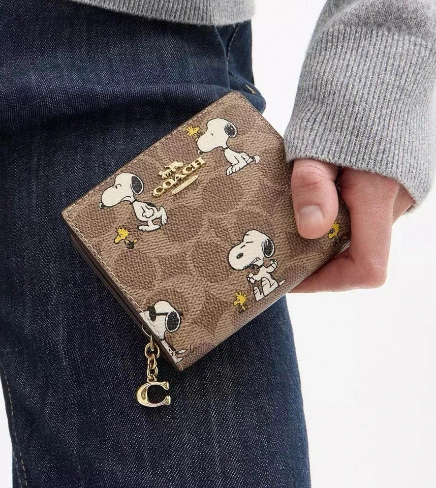 Coach X Peanuts Snap Wallet In Signature Canvas With Snoopy Print CBN32